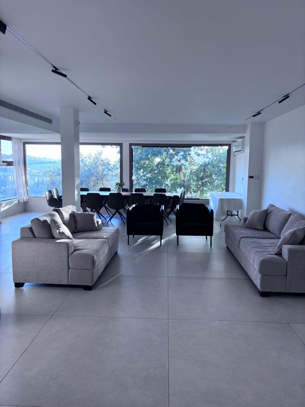 Showcase living room window overlooking forest and the Jerusalem hills