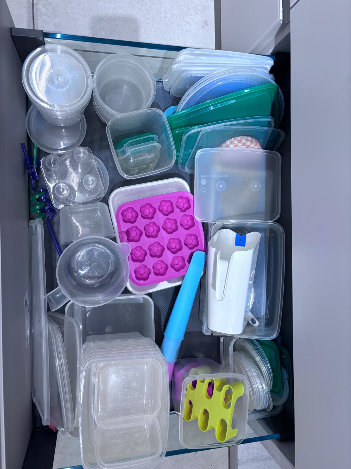 Fitted kitchen storage drawer with organised contents